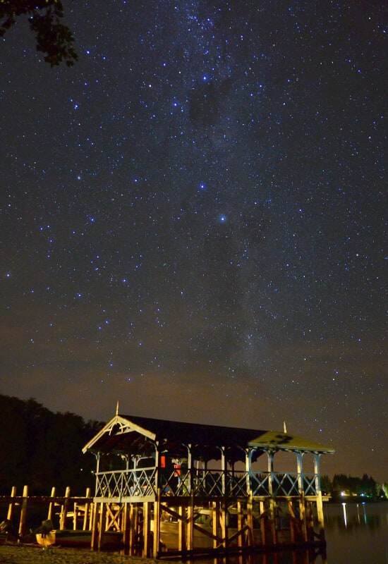 The boathouse out the back of the lodge is accompanied by a star-filled sky during the mid evening.