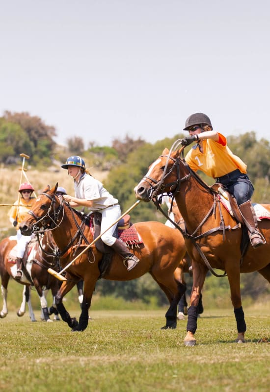 Some guests enjoy polo on the green surrounding the estancia.