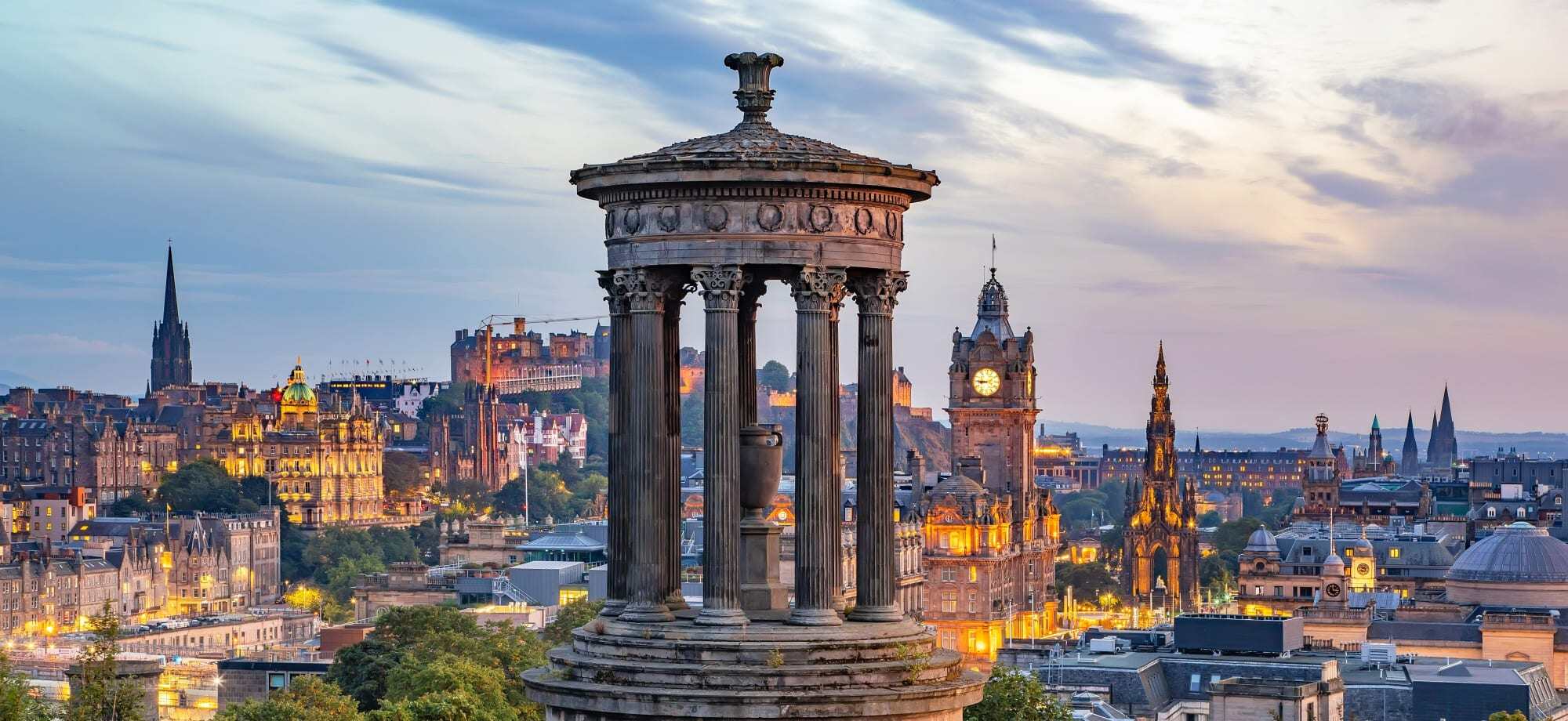 Edinburgh city glows during a pleasant evening in Scotland.