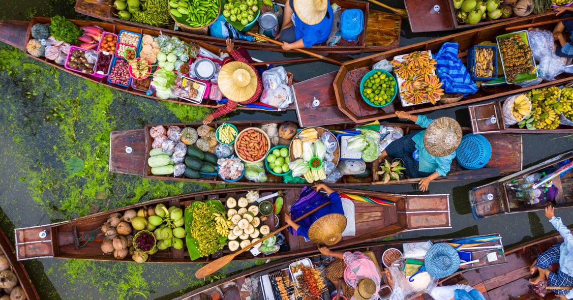 A floating market in Thailand is seen from an aerial view.