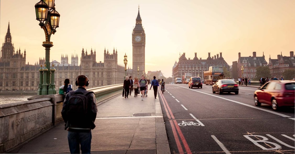 A man walks across Tower Bridge in London, UK.