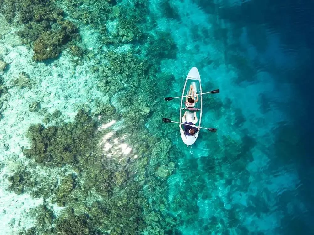 couple-kayaking-in-blue-water-1