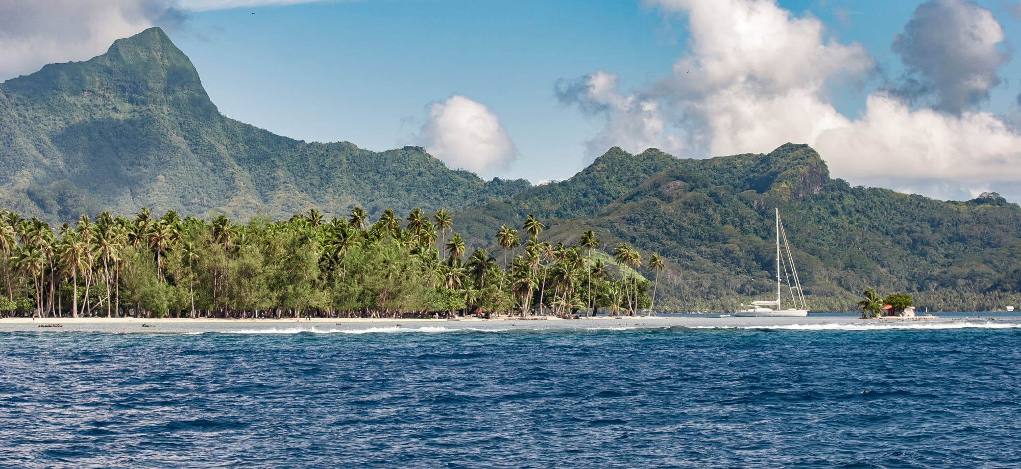 Approaching Raiatea Island from sea on a boat, French Polynesia, Society Islands, south pacific