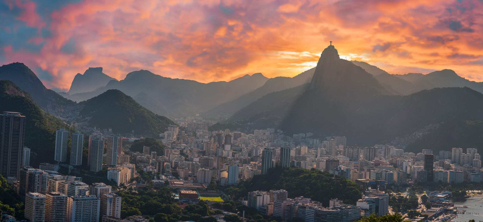 Rio de Janeiro dazzles during a gentle sunset over the mountains.