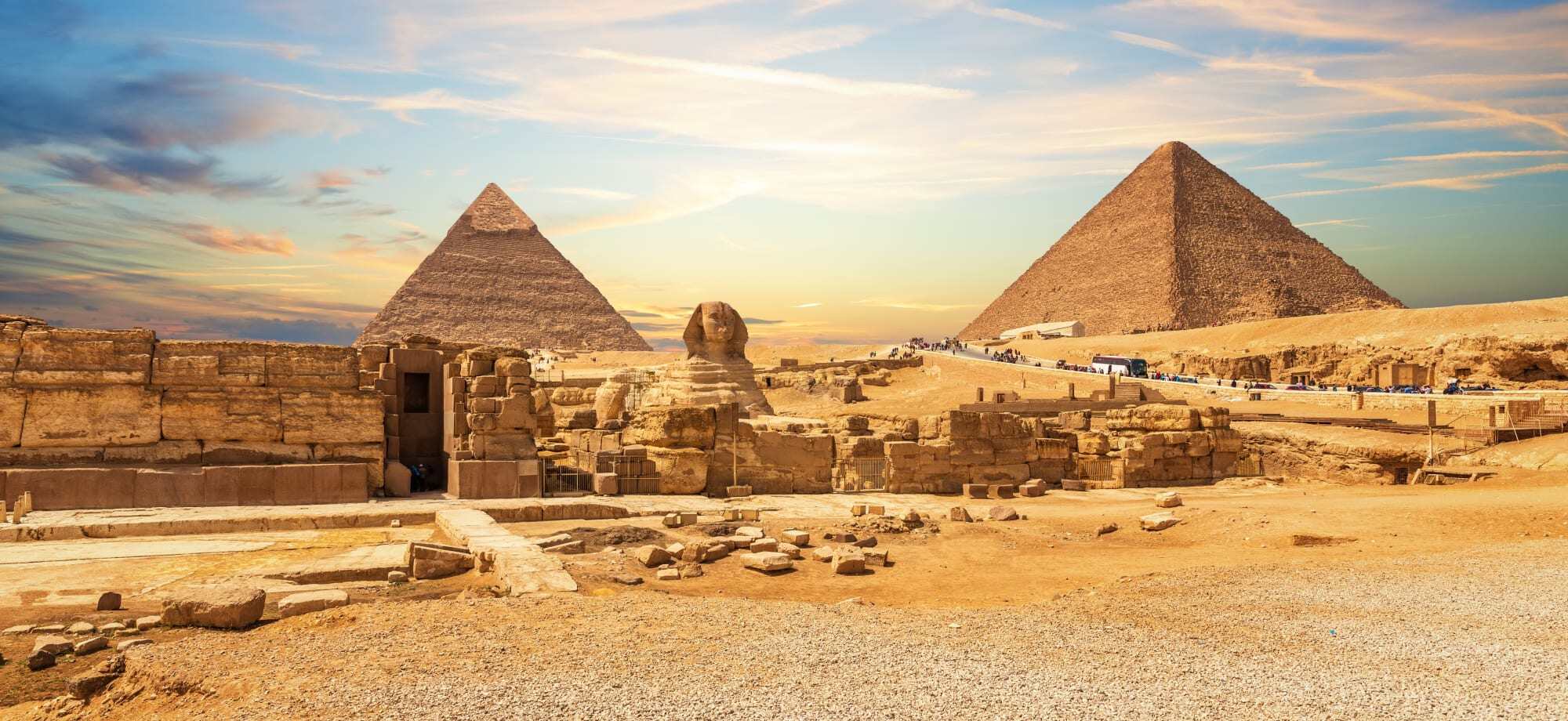 visit the iconic landmarks in Cairo, like the pyramids of Giza.