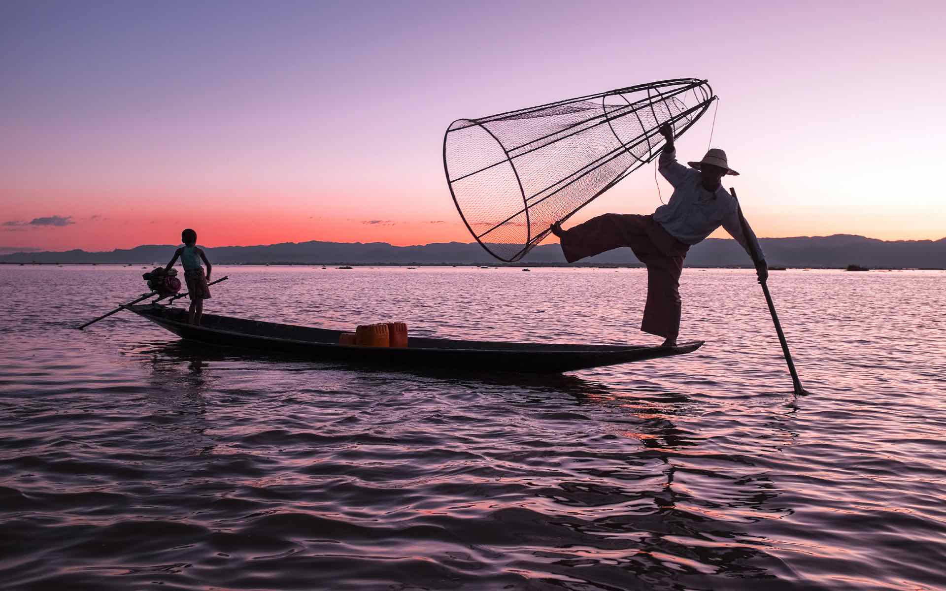 fisherman sunset in lake Myanmar