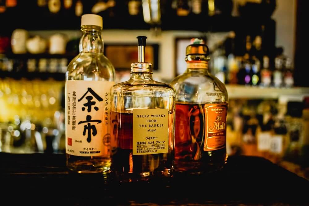Japan Food Guide - Japanese whisky bottles on a bar